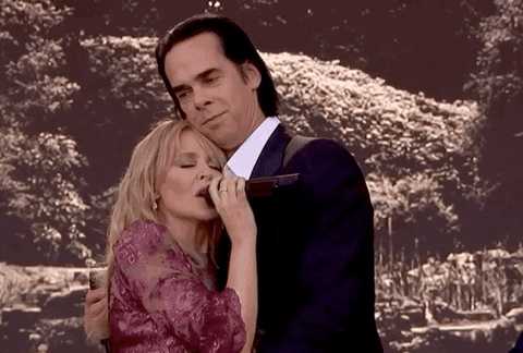 Nick Cave bailando con una cantante famosa mientras cantan canciones sin inteligencia artificial.- Blog Hola Telcel